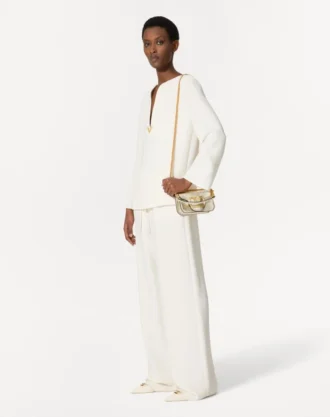 Kleine Valentino Garavani Locò Schultertasche aus metallischem Kalbsleder